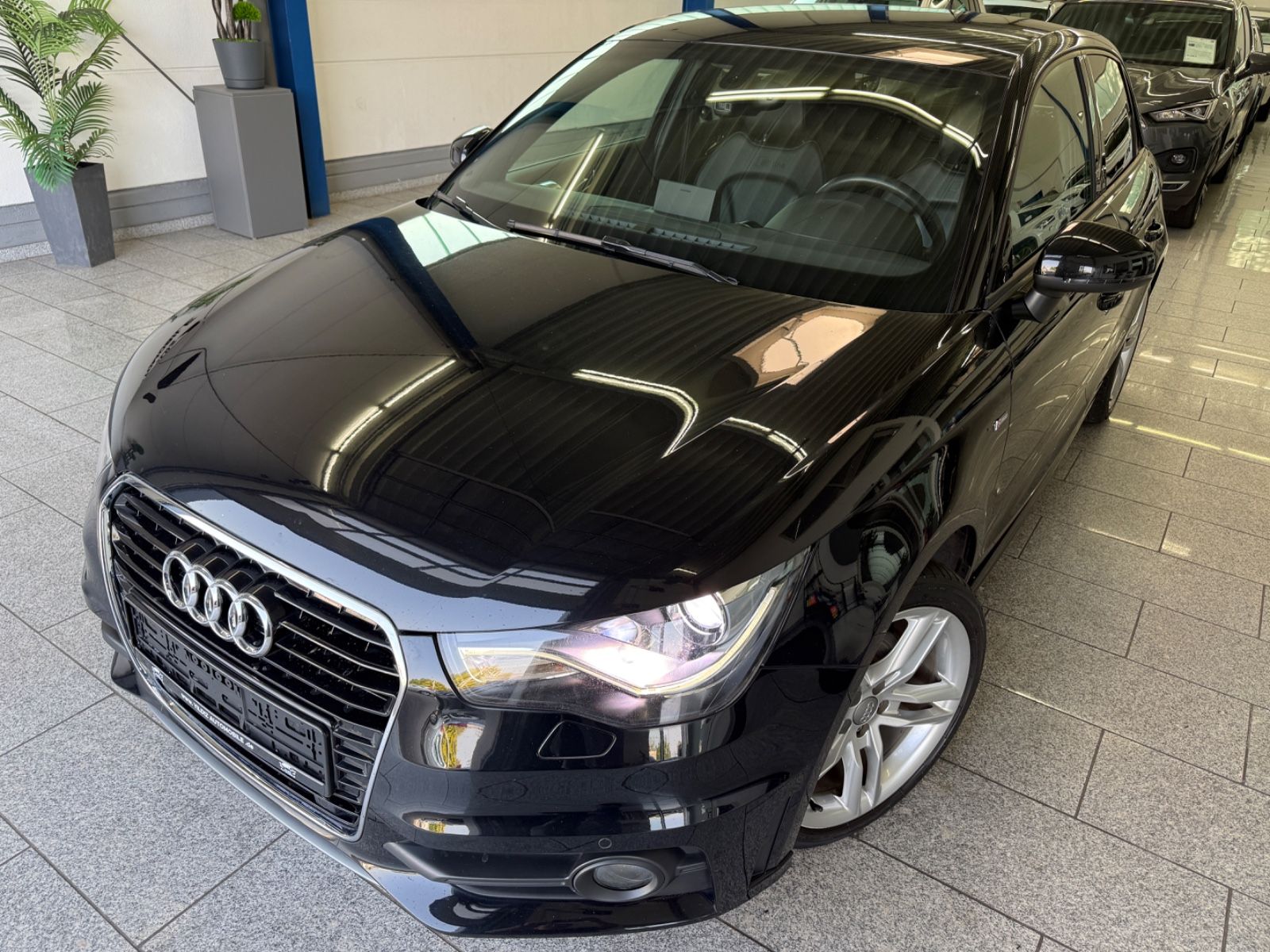 Audi A1 2012, 88 828 км, 90 kW (122 PS) бензин, автомат — фото с аукциона, доставка в Беларусь